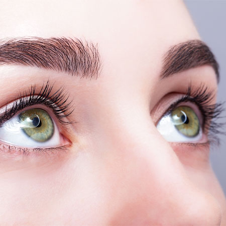 Close up of woman's green eyes